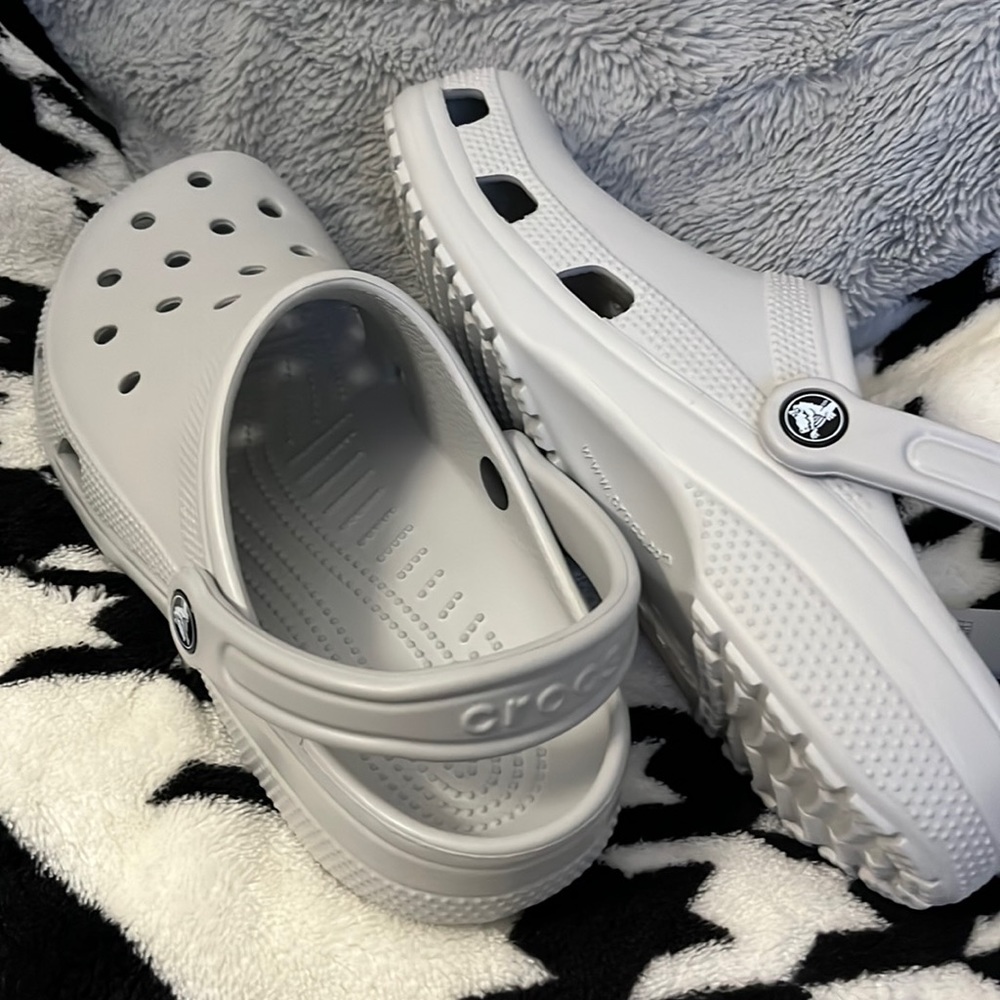 Size 10 W, size 8 M brand new baby blue / silver color crocs
